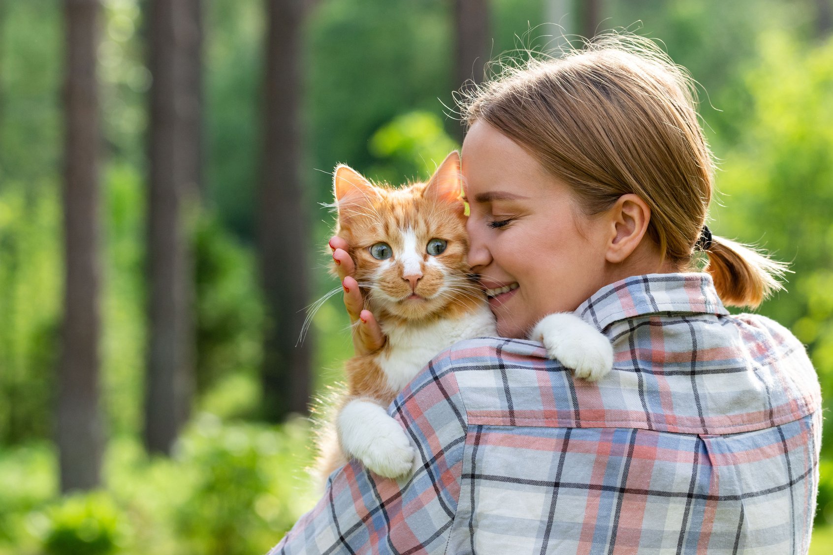 Woman with Pet Cat Outdoors